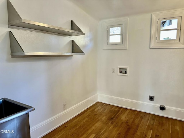 laundry area featuring hookup for a washing machine, hookup for an electric dryer, laundry area, baseboards, and dark wood finished floors