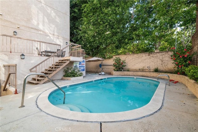 view of pool featuring a patio