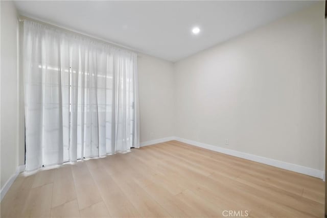 empty room with light wood-type flooring