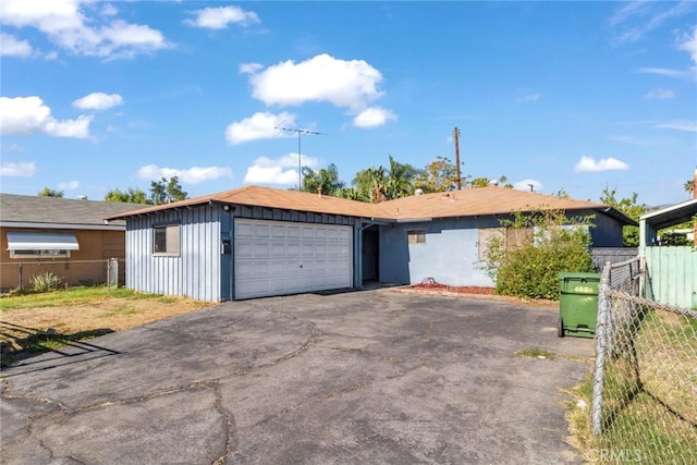 single story home featuring a garage