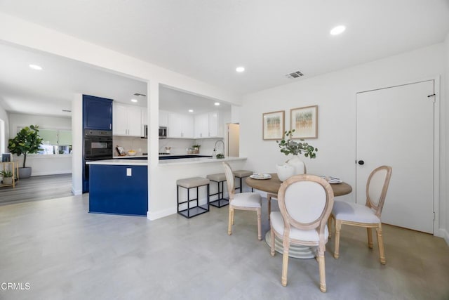 dining room featuring sink