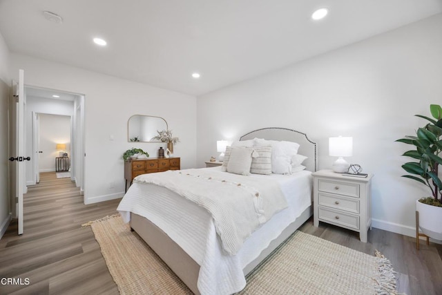 bedroom with hardwood / wood-style floors