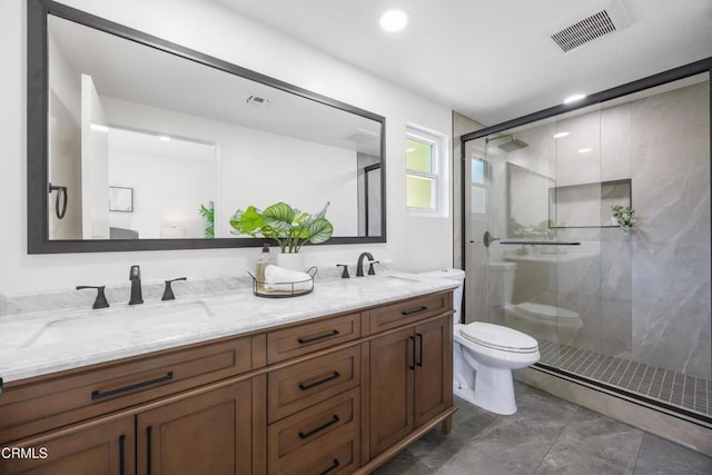 bathroom featuring toilet, vanity, and an enclosed shower