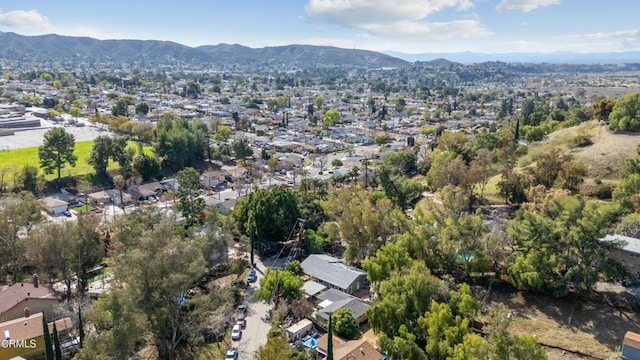 birds eye view of property with a mountain view