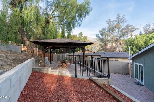 deck featuring a patio and a gazebo