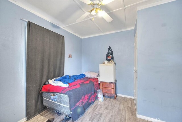 946 E J St, Ontario, CA 91764 - bedroom with baseboards, a ceiling fan, and wood finished floors