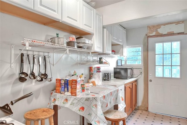 946 E J St, Ontario, CA 91764 - kitchen with white cabinets, open shelves, and light countertops