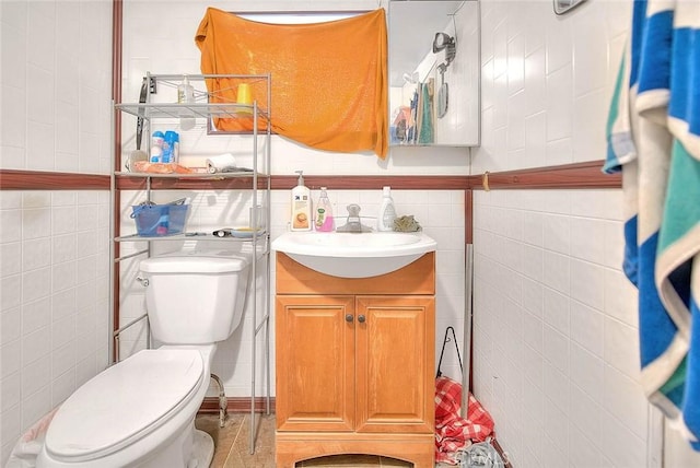 946 E J St, Ontario, CA 91764 - bathroom featuring tile walls, vanity, and toilet