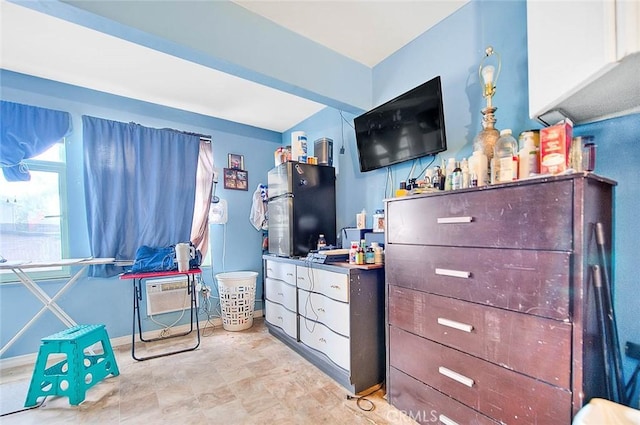 946 E J St, Ontario, CA 91764 - bedroom featuring freestanding refrigerator and an AC wall unit