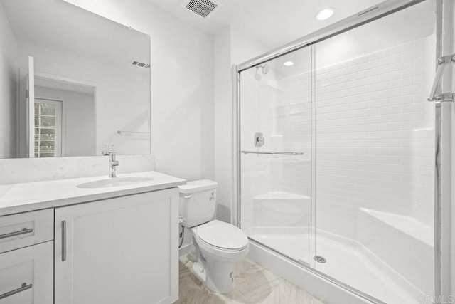 full bath featuring vanity, a stall shower, toilet, visible vents, and marble finish floor