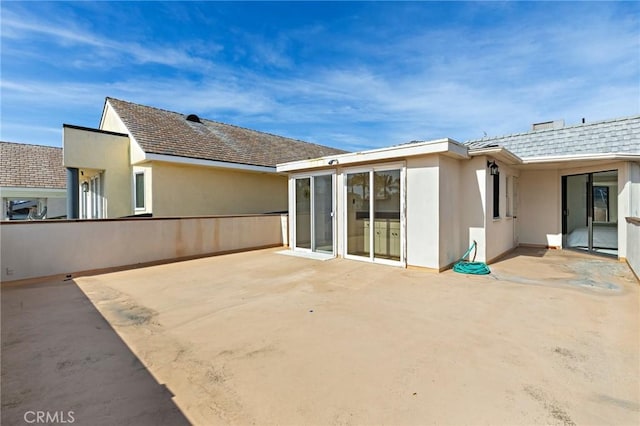 rear view of property with a patio area