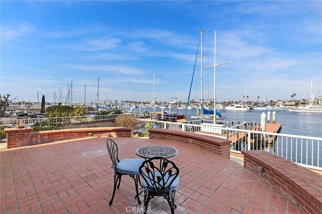 view of patio / terrace with a water view