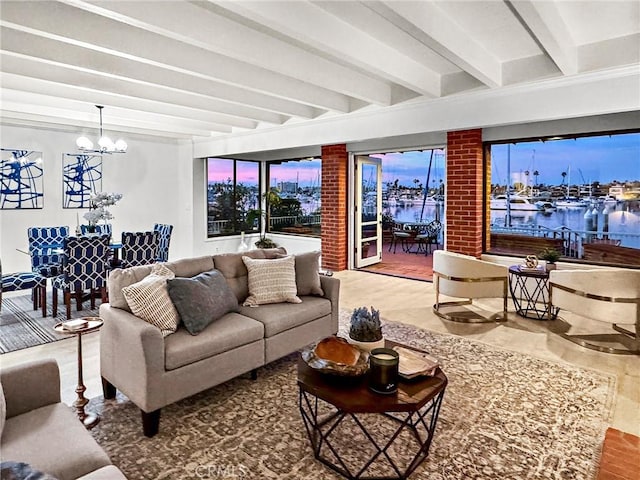 living room with a water view, an inviting chandelier, and beam ceiling