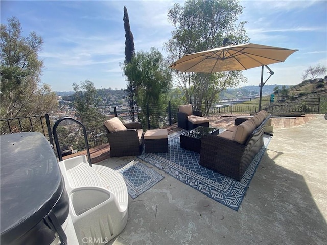 view of patio / terrace featuring fence and an outdoor living space