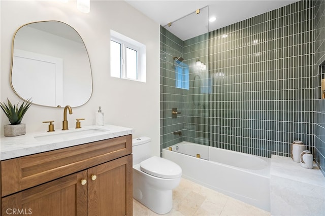 bathroom with shower / washtub combination, vanity, and toilet