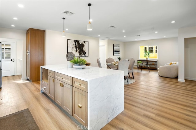 kitchen with open floor plan, light wood-type flooring, visible vents, and recessed lighting