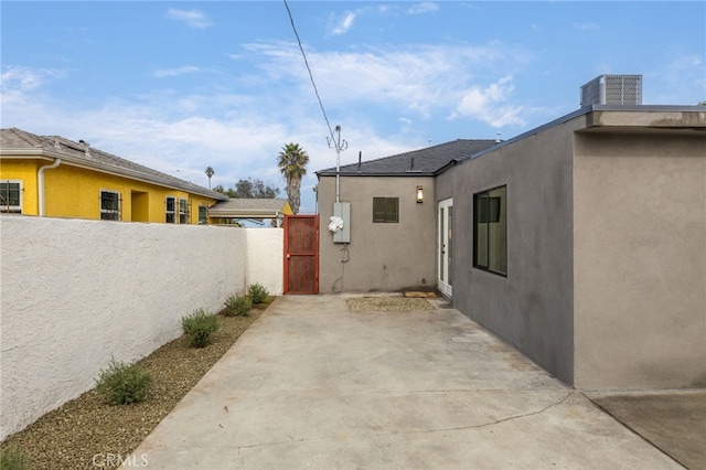 exterior space featuring fence and a gate