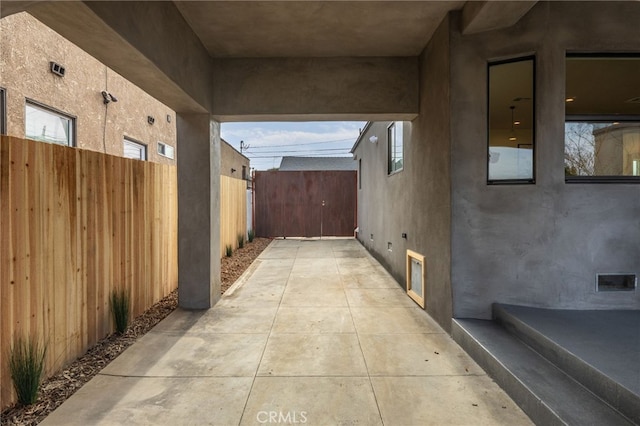 view of patio / terrace with fence and visible vents