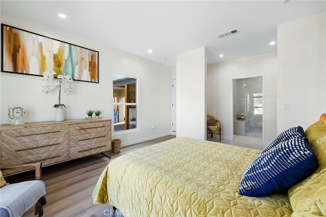 bedroom featuring baseboards, visible vents, wood finished floors, and recessed lighting