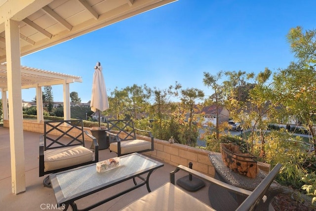 view of patio with outdoor lounge area and a pergola