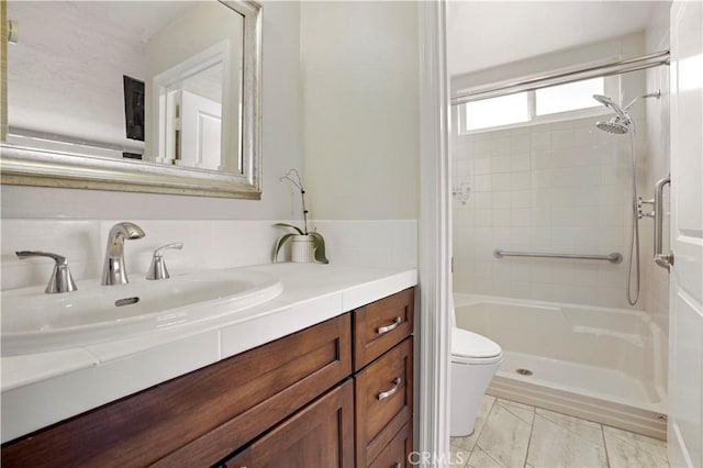 full bathroom with walk in shower, vanity, and toilet