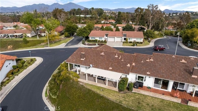 birds eye view of property with a residential view and a mountain view