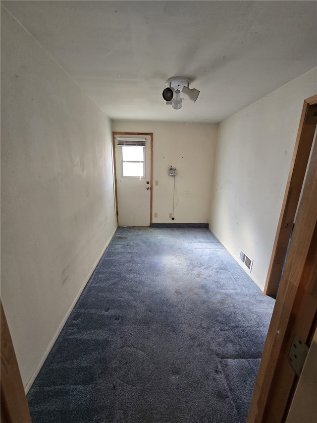 interior space with visible vents, baseboards, and carpet flooring