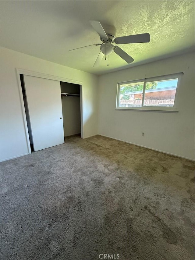 749 Junipero Ct, Merced, CA 95348 - unfurnished bedroom featuring a closet, ceiling fan, and carpet flooring