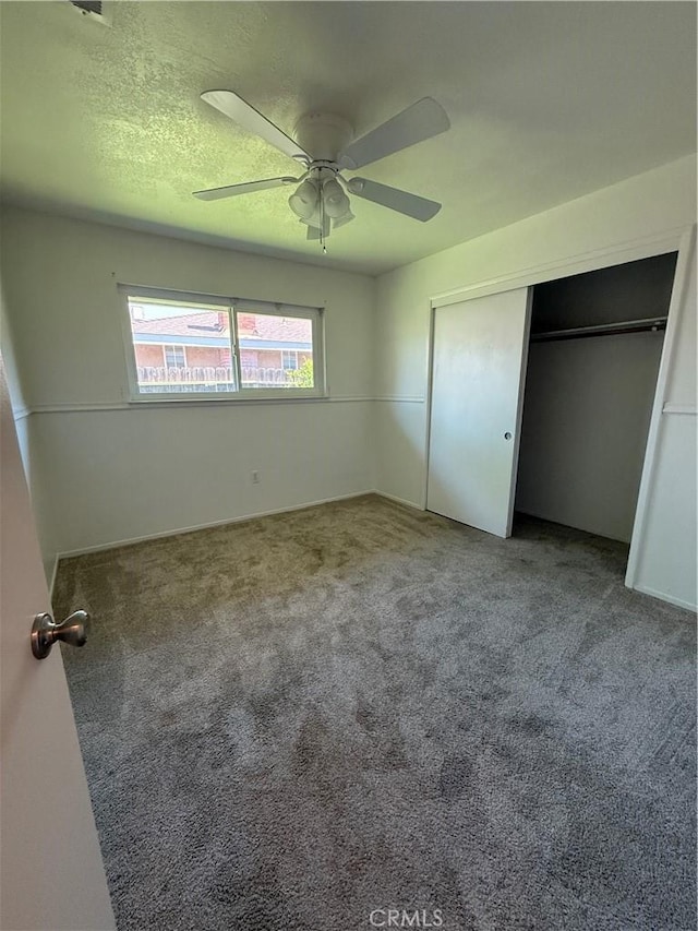 749 Junipero Ct, Merced, CA 95348 - unfurnished bedroom featuring a closet, carpet flooring, and a ceiling fan