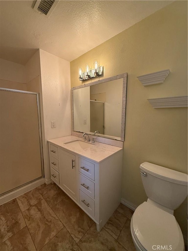 749 Junipero Ct, Merced, CA 95348 - bathroom with visible vents, vanity, toilet, a textured ceiling, and a shower stall