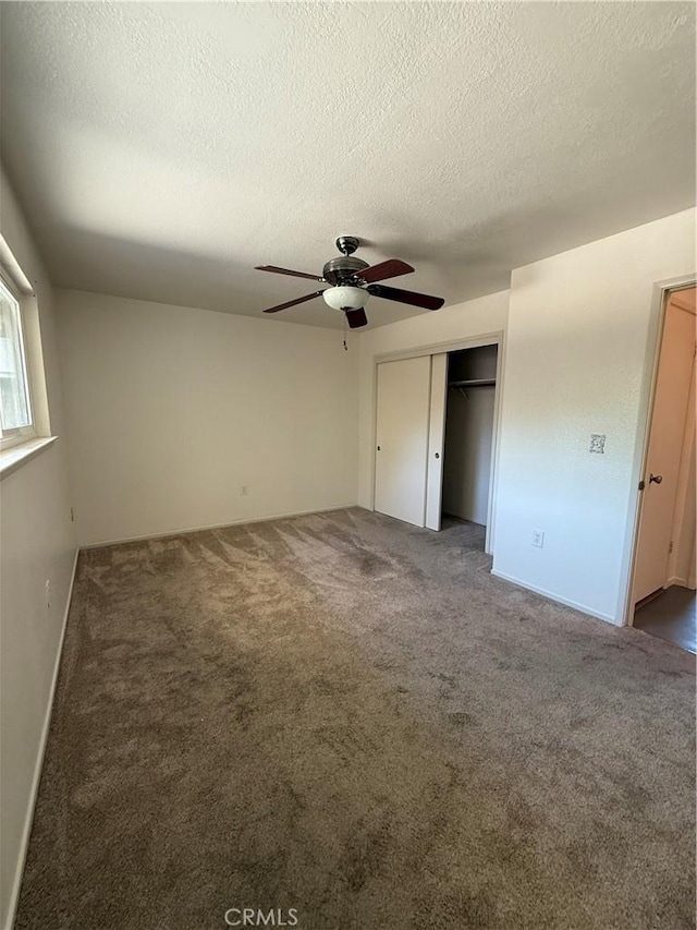 749 Junipero Ct, Merced, CA 95348 - unfurnished bedroom with a closet, carpet, and a textured ceiling