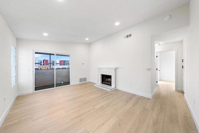 unfurnished living room featuring light hardwood / wood-style flooring