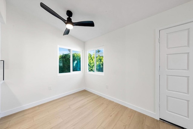 unfurnished room featuring ceiling fan, light hardwood / wood-style flooring, and vaulted ceiling