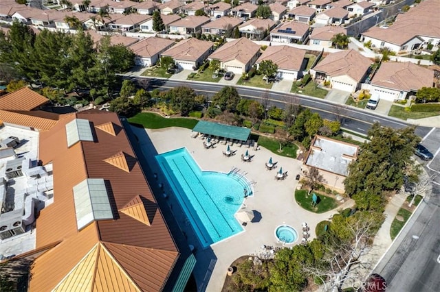 birds eye view of property with a residential view