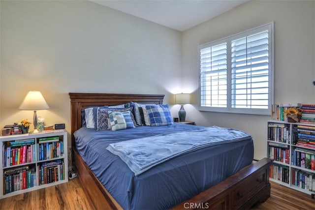 bedroom featuring wood finished floors