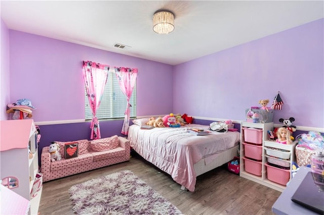 bedroom featuring hardwood / wood-style flooring