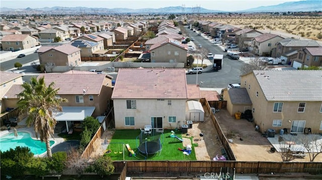 birds eye view of property featuring a mountain view