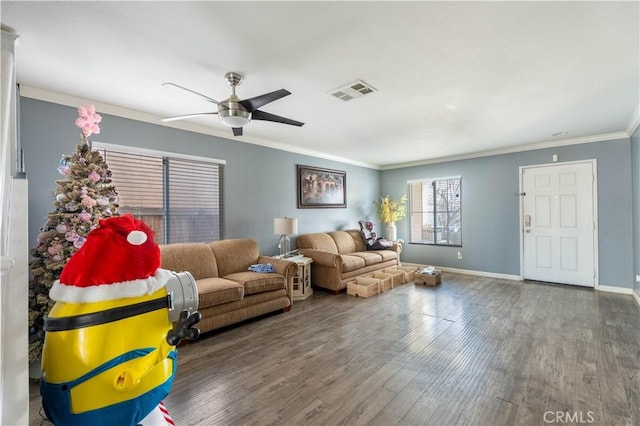 living room with hardwood / wood-style flooring, crown molding, and ceiling fan