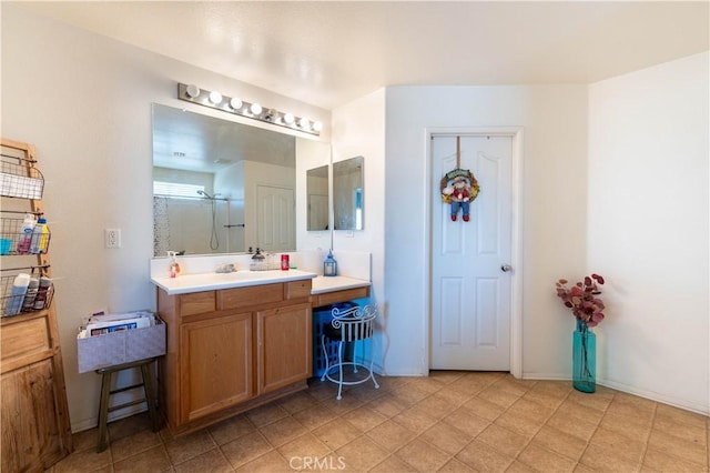 bathroom with an enclosed shower and vanity