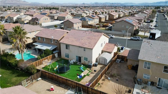 birds eye view of property with a mountain view