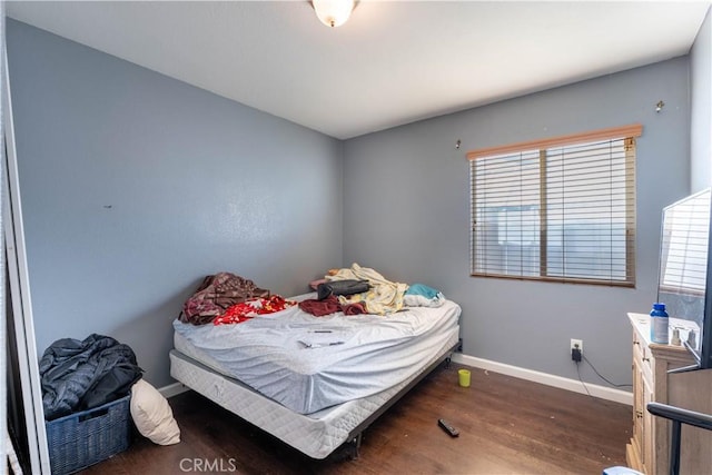 bedroom featuring dark wood-type flooring