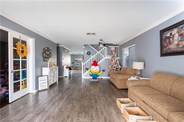 living room with ceiling fan, ornamental molding, and wood-type flooring