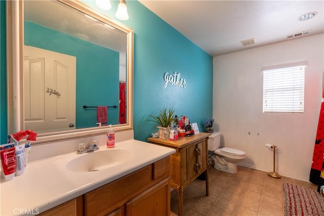 bathroom with vanity and toilet