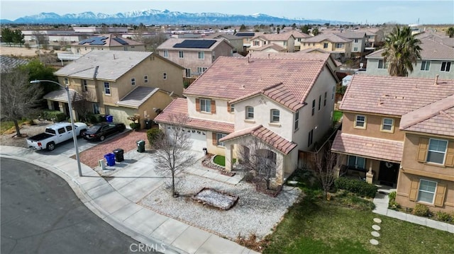 birds eye view of property featuring a mountain view