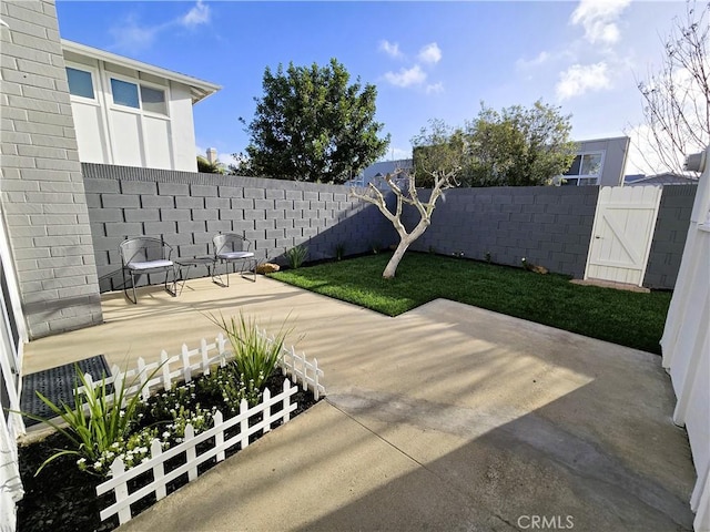 view of patio featuring fence