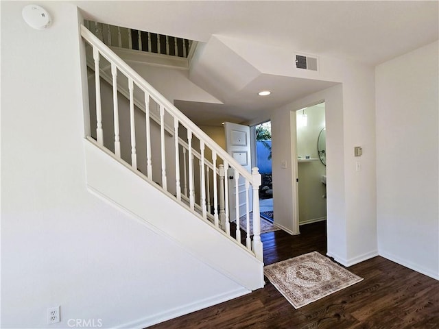 entrance foyer featuring recessed lighting, dark wood-style flooring, visible vents, baseboards, and stairway