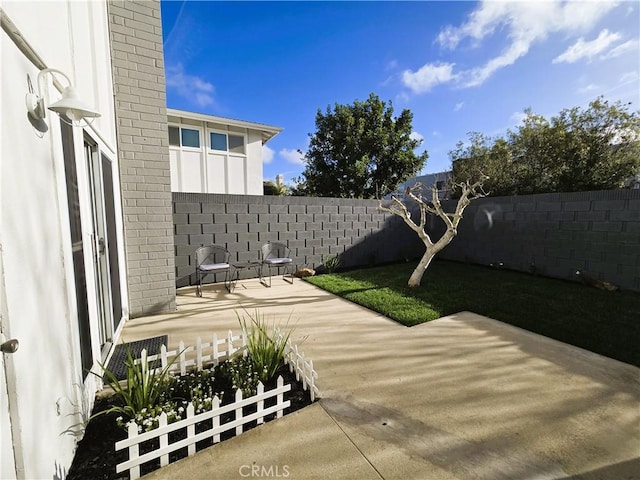 view of patio featuring a fenced backyard