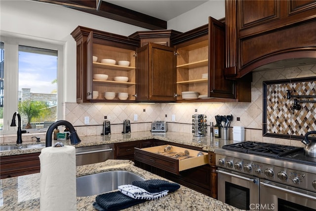 kitchen featuring decorative backsplash, light stone countertops, custom exhaust hood, and double oven range