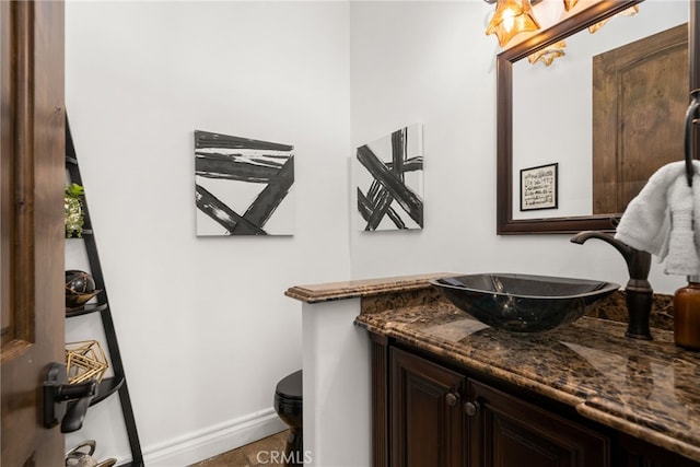 bathroom featuring toilet and vanity