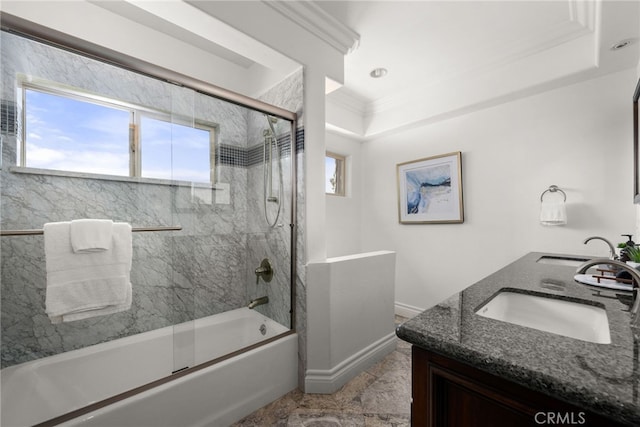 bathroom featuring a healthy amount of sunlight, ornamental molding, vanity, and enclosed tub / shower combo